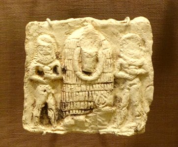 Plaque of unidentified god with two nude men, Iraq, Isin-Larsa to Old Babylonian, 2000-1600 BC, baked clay - Oriental Institute Museum, University of Chicago - DSC07410