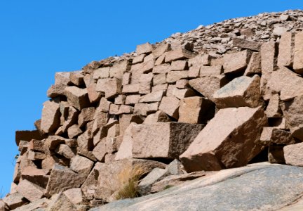 Piled leftover rocks at Sandvik abandoned quarry photo