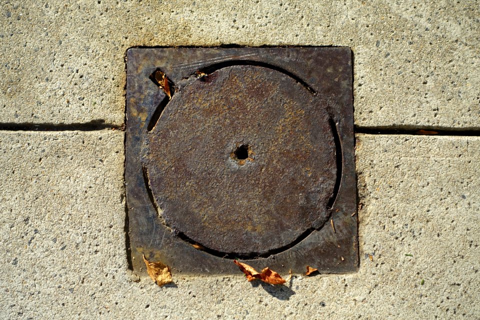 Plain disk in square street hole cover - Beacon Hill - Boston, MA - DSC02279