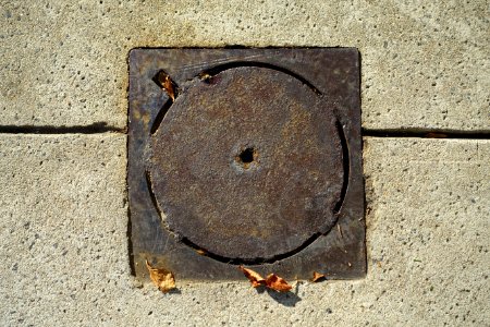 Plain disk in square street hole cover - Beacon Hill - Boston, MA - DSC02279