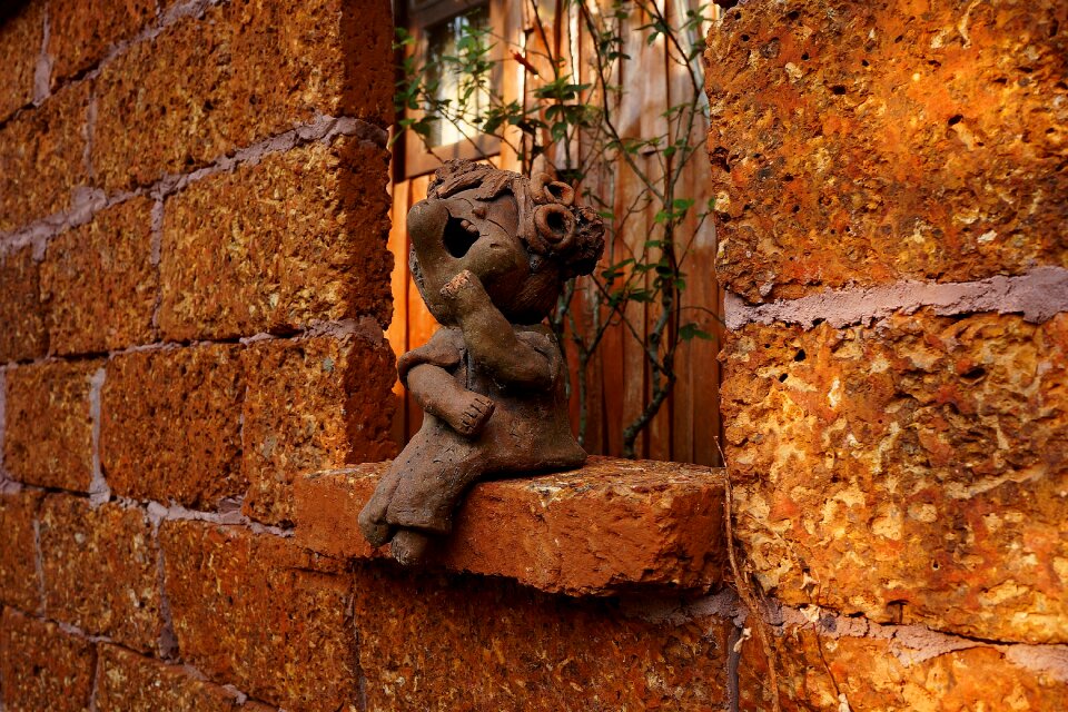 Terracotta figurine incident light architectural form