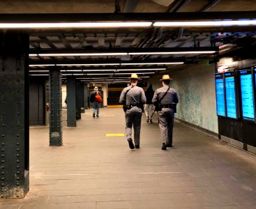 Police patrol in Penn Station Subway 123 line