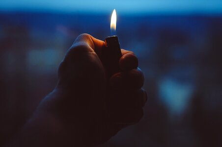 Holding light flame photo