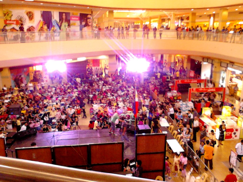 People gather at an event at the atrium of Robinsons Starmills Mall in the City of San Fernando, Pampanga, Philippines
