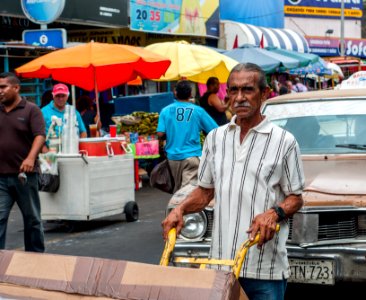 Person moving merchandise for sale in downtown Maracaibo