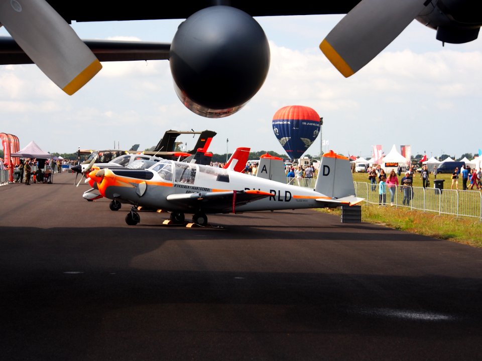PH-RLD Saab S91D Safir from under a Hercules wing