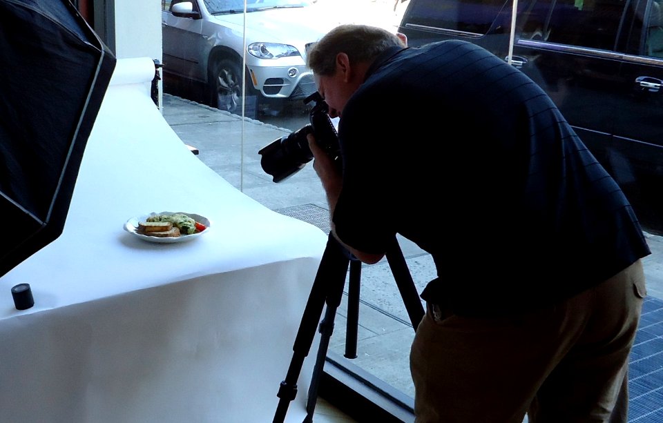 Photographer Pim Van Hemmen taking a photo cropped