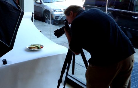 Photographer Pim Van Hemmen taking a photo cropped