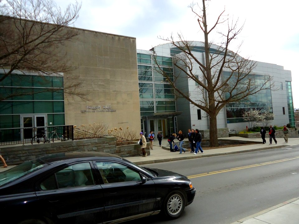 Phillips Hall and car and students at Cornell University