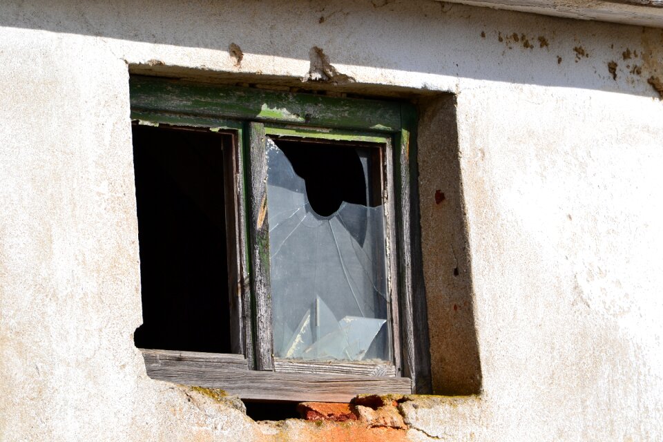 Broken glass old wall
