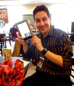 Salesman demonstrating Nook tablet in a Barnes & Noble bookstore