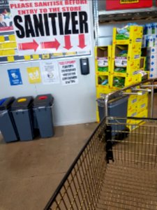 Sanitizer dispenser at supermarket