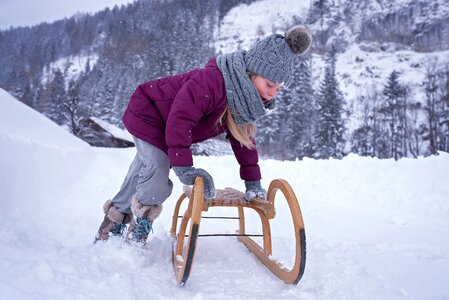 Girl toboggan slide photo