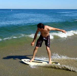 Sandy Hook NJ beach surf board rider on board photo