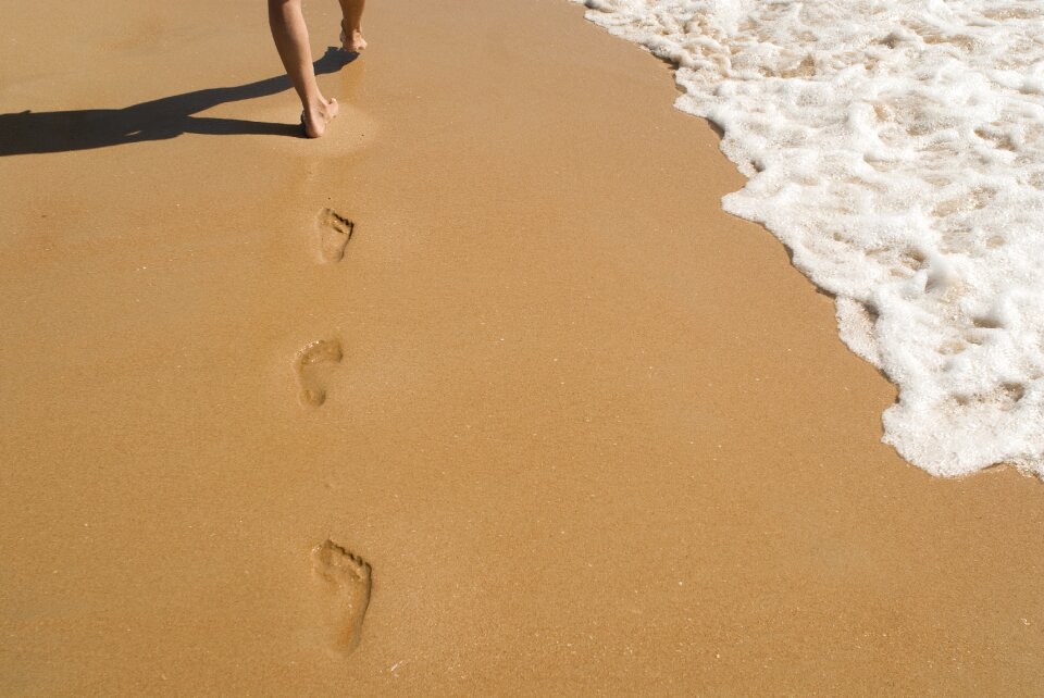 Walking footprints ocean
