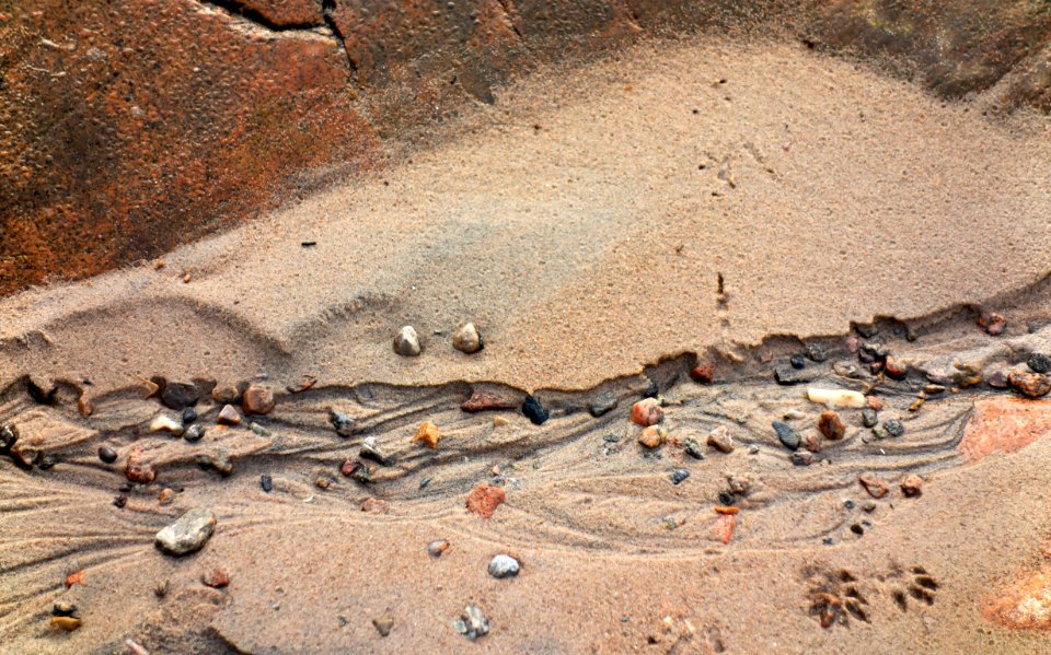 Sand formed by water below a cliff in Govik 2