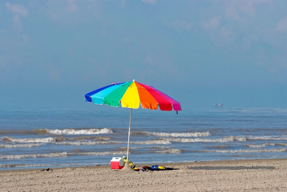 Colorful sunbathers ocean