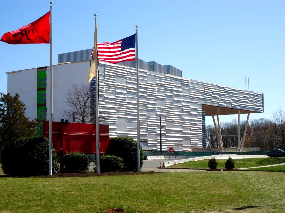 Rutgers University Livingston campus building with flags