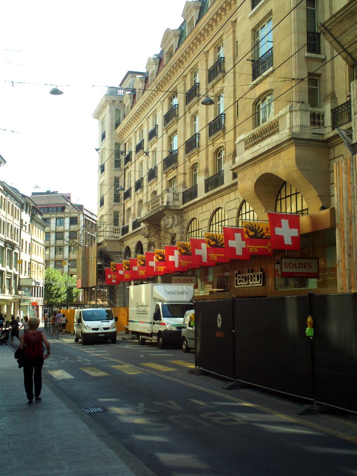 Rue du Rhone with Swiss and cantonal flags