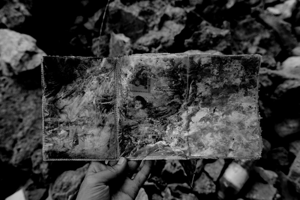 Ruined photos left behind by a Muslim family in Shingal (Sinjar) found in a destroyed home after war with the Islamic State 04