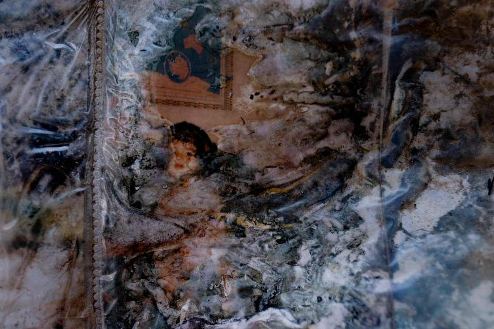 Ruined photos left behind by a Muslim family in Shingal (Sinjar) found in a destroyed home after war with the Islamic State 05