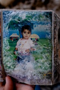 Ruined photos left behind by a Muslim family in Shingal (Sinjar) found in a destroyed home after war with the Islamic State 11