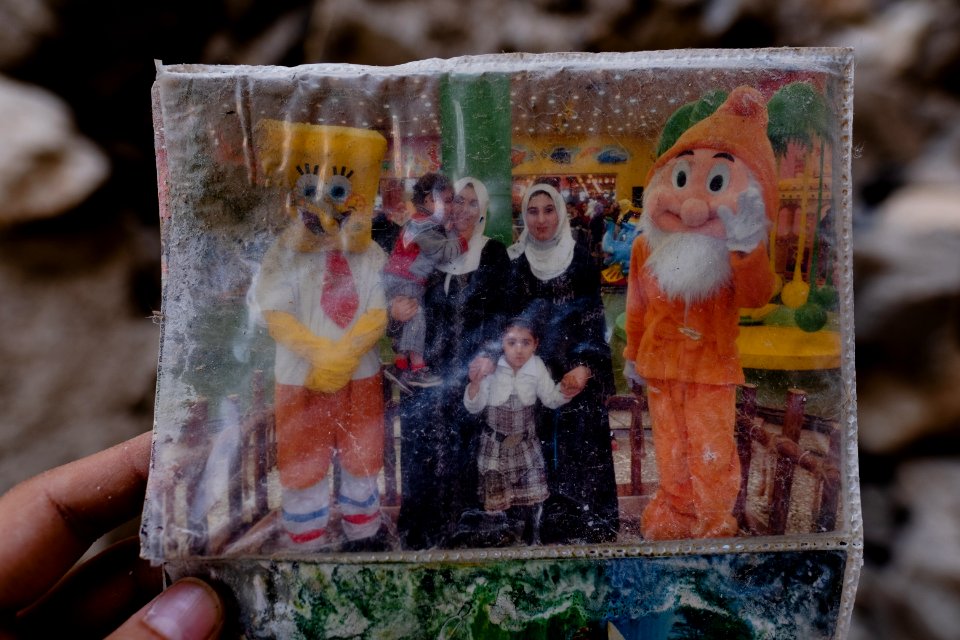 Ruined photos left behind by a Muslim family in Shingal (Sinjar) found in a destroyed home after war with the Islamic State 09