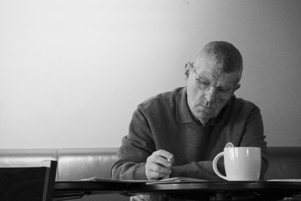 Male writing serious