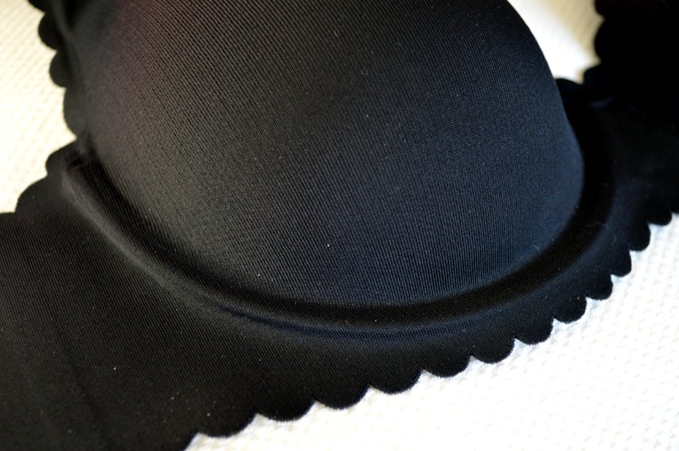 Seamless black T-shirt bra, close-up