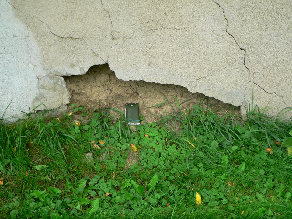 SDSU dean residence rammed-earth wall, W end damage 2