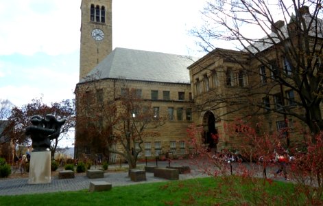 Sculpture and buildings and clock tower at Cornell University