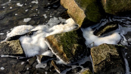 Sea foam among rocks in Loddebo 3 photo