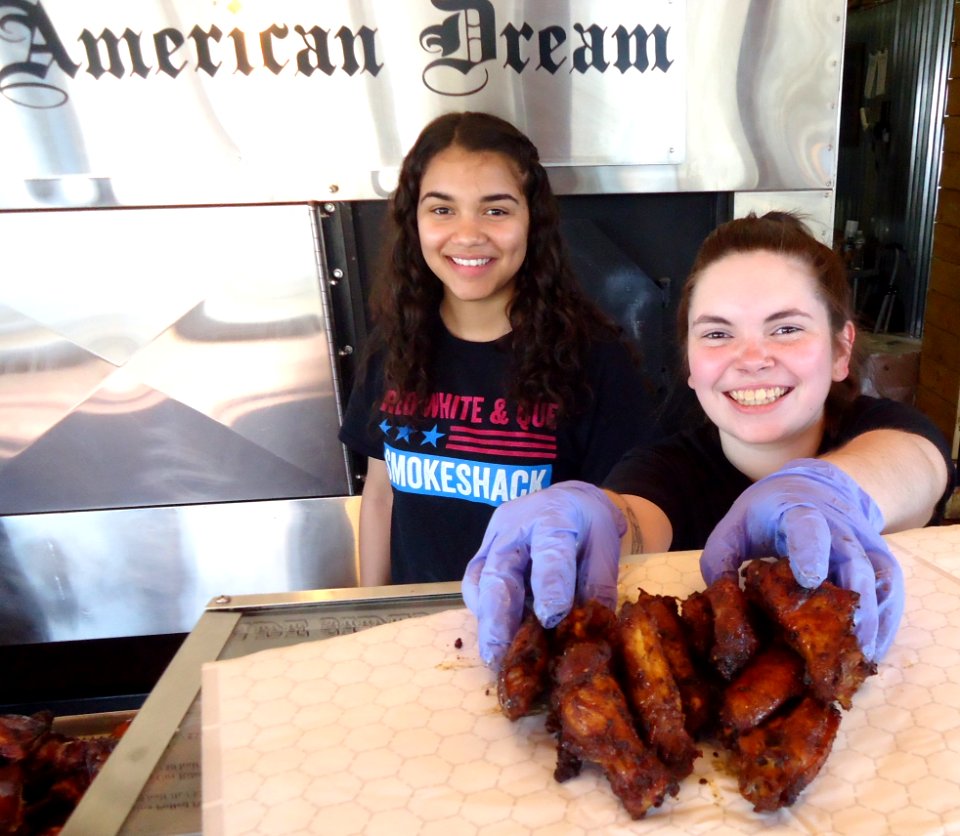 Servers and preparers with barbecue food at Red White and Que restaurant in New Jersey
