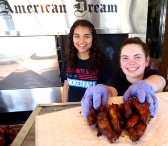 Servers and preparers with barbecue food at Red White and Que restaurant in New Jersey