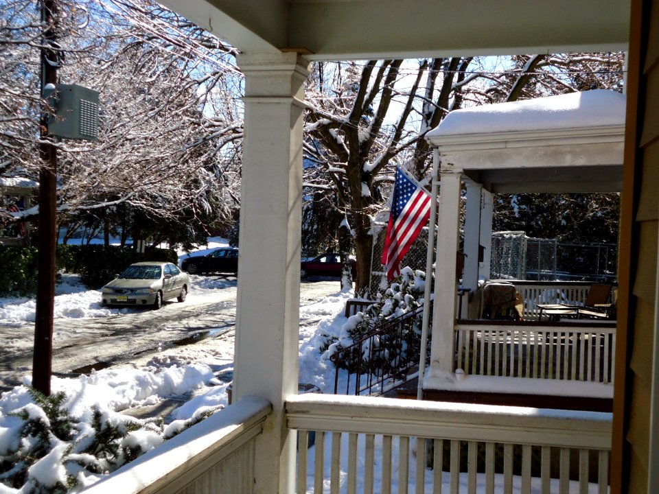 Scene from porch winter in Summit NJ with flag and snow