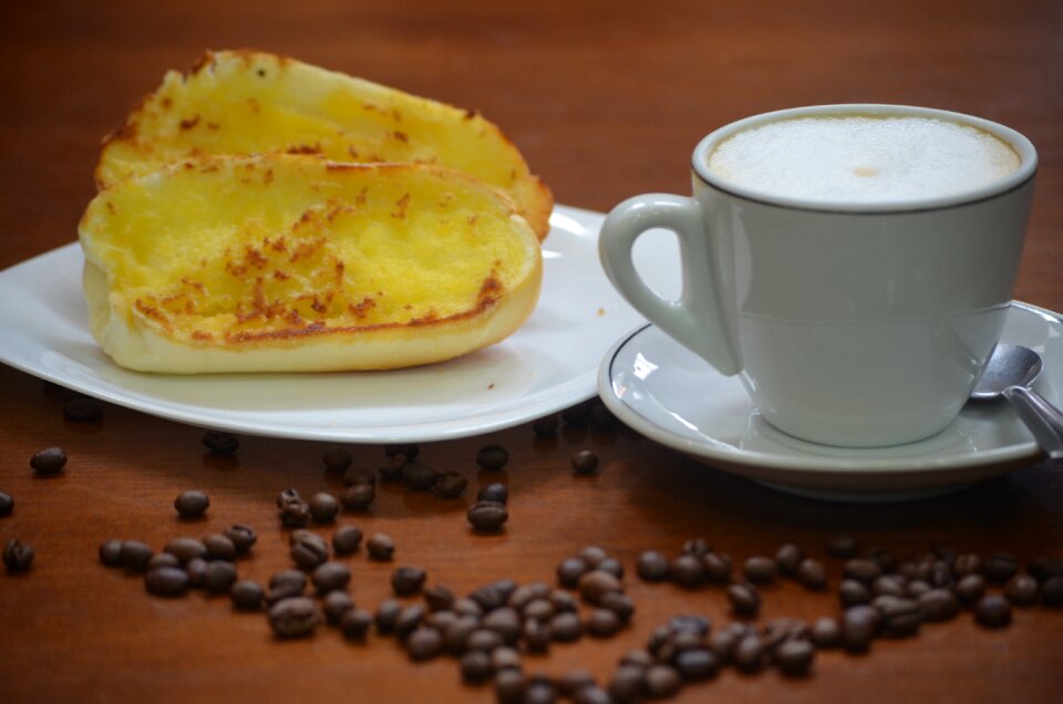 Coffee with milk bread and butter breakfast