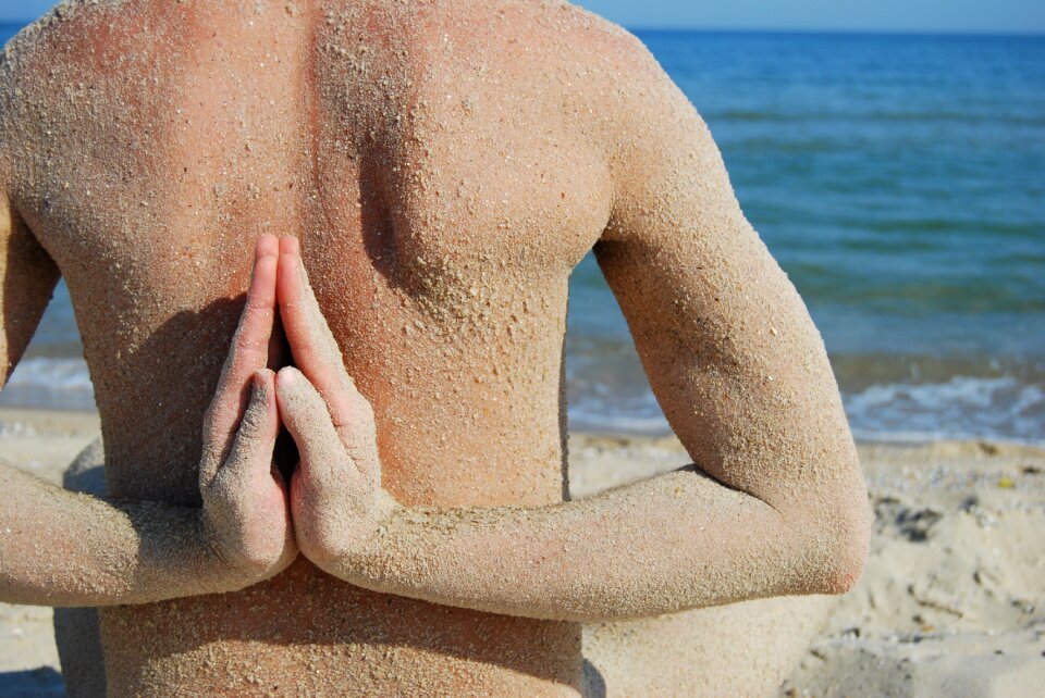 Fingers sea sand