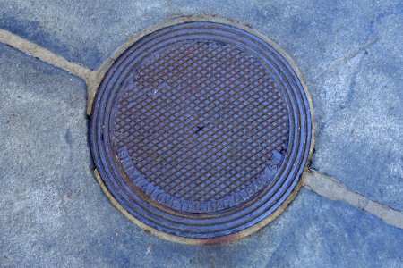 Smith & Lovett Co. 125 Albany St street hole cover - Beacon Hill - Boston, MA - DSC02316