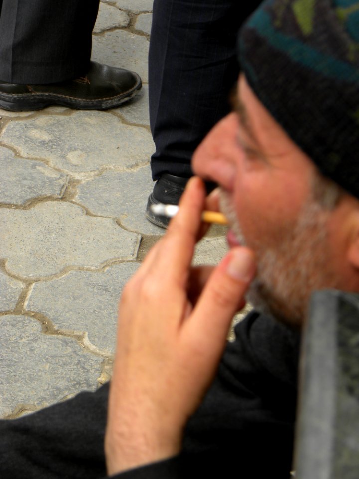 Smoking man Kneeling sitting at Nishapur 1