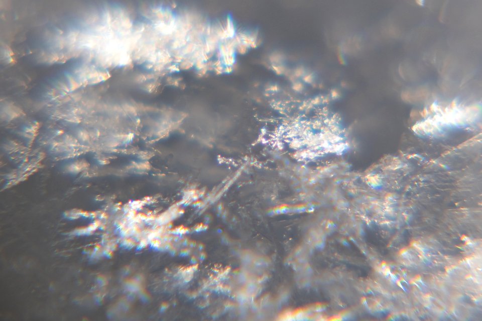 Snow crystals glittering in strong direct sunlight 39 - cropped
