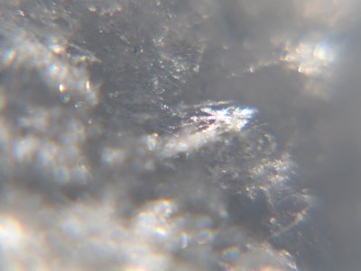 Snow crystals glittering in strong direct sunlight 50