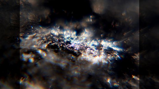 Snow crystals glittering in strong direct sunlight 48 - fancy crop - high contrast