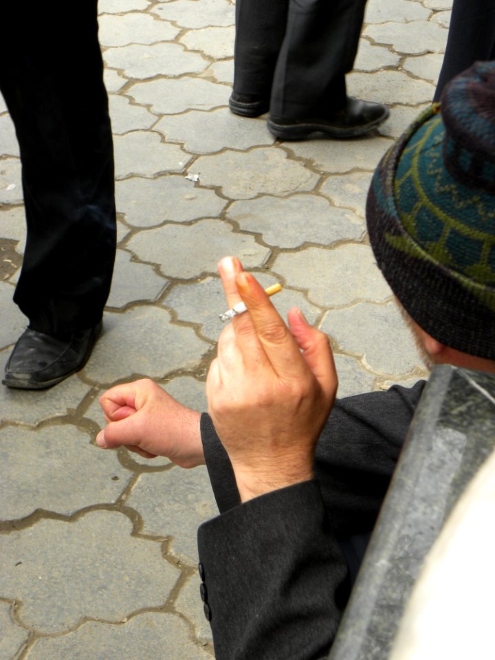 Smoking man Kneeling sitting at Nishapur 2