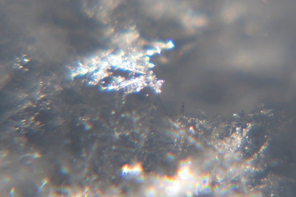 Snow crystals glittering in strong direct sunlight 11 - cropped