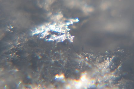 Snow crystals glittering in strong direct sunlight 11 - cropped