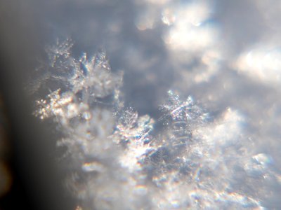 Snow crystals glittering in strong direct sunlight 04