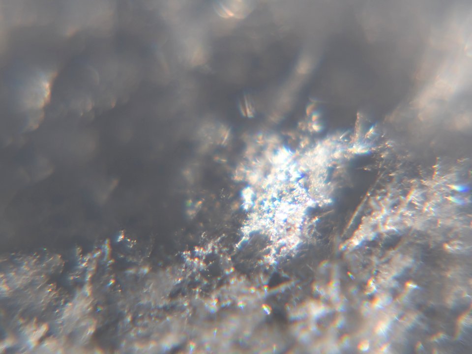 Snow crystals glittering in strong direct sunlight 33
