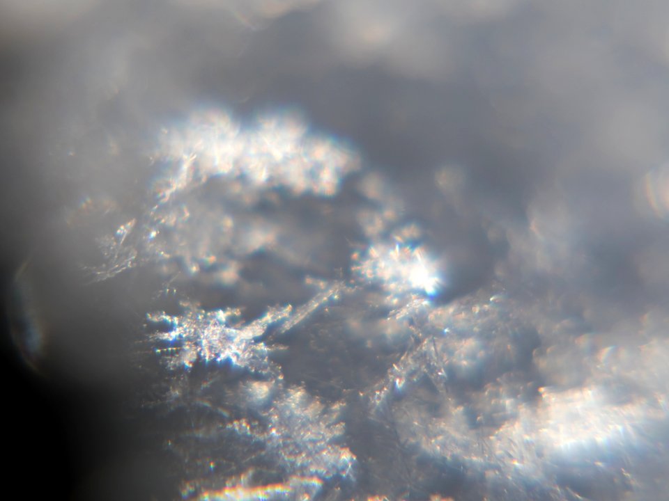 Snow crystals glittering in strong direct sunlight 22