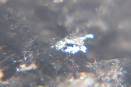 Snow crystals glittering in strong direct sunlight 26 - cropped