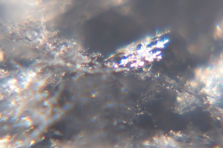 Snow crystals glittering in strong direct sunlight 43 - cropped